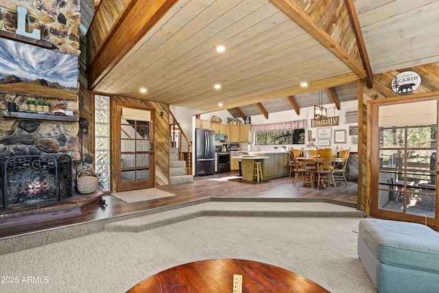 4511 N Ponderosa Dr, Pine, AZ 85544 - living area featuring dark wood-style floors, vaulted ceiling, stairway, recessed lighting, and wooden ceiling