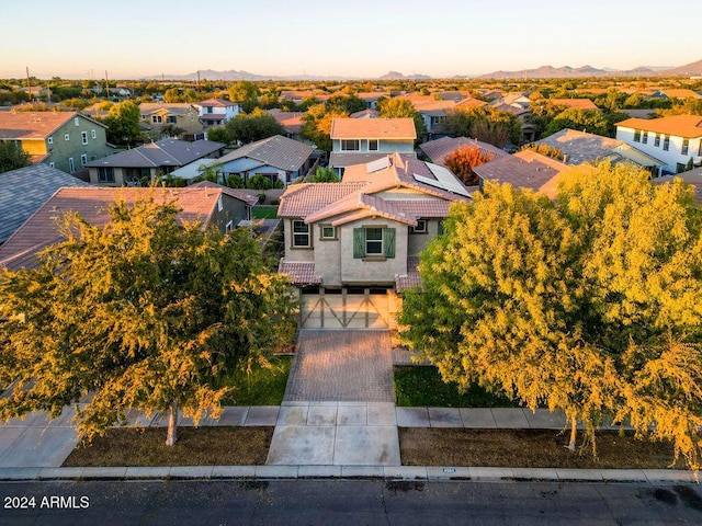 drone / aerial view featuring a residential view and a mountain view