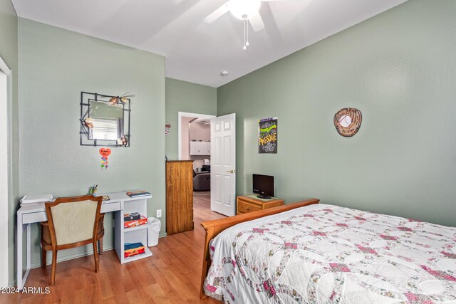 bedroom with ceiling fan and light hardwood / wood-style flooring