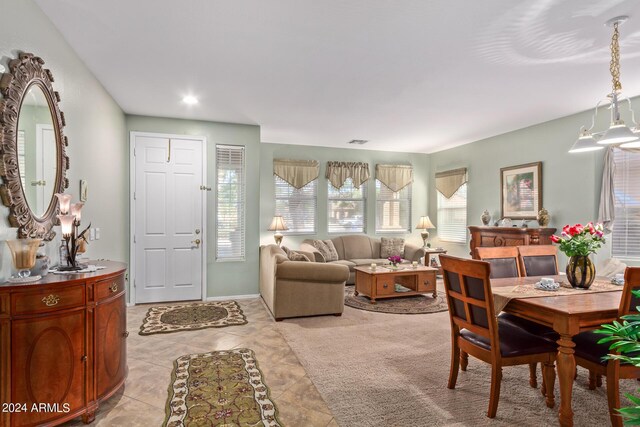 living room with wood-type flooring, lofted ceiling, ceiling fan, and a wealth of natural light