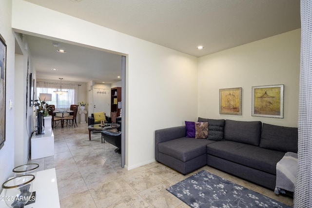 living room featuring recessed lighting and baseboards