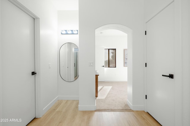 corridor featuring light hardwood / wood-style floors