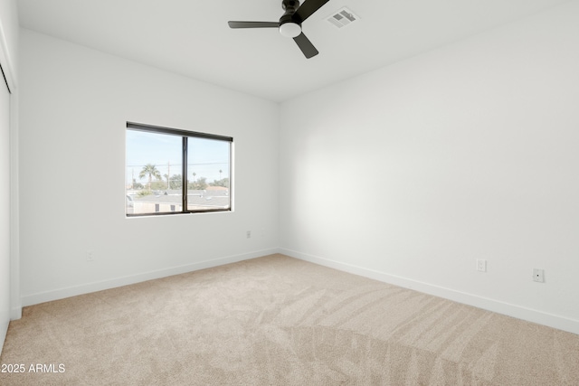 unfurnished room with ceiling fan and carpet floors