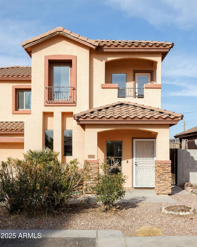 mediterranean / spanish house with a balcony