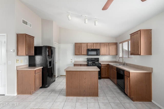 kitchen with light countertops, brown cabinetry, a kitchen island, a sink, and black appliances