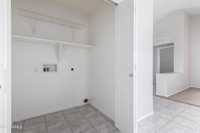 clothes washing area featuring laundry area, light tile patterned floors, visible vents, hookup for a washing machine, and hookup for an electric dryer