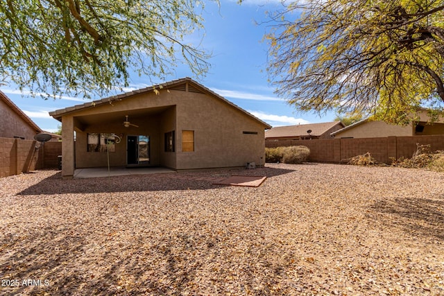 back of property featuring a patio area, a fenced backyard, a ceiling fan, and stucco siding