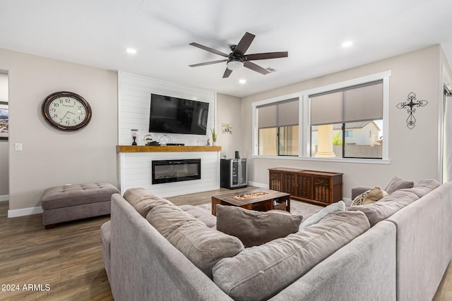 living room with hardwood / wood-style floors and ceiling fan