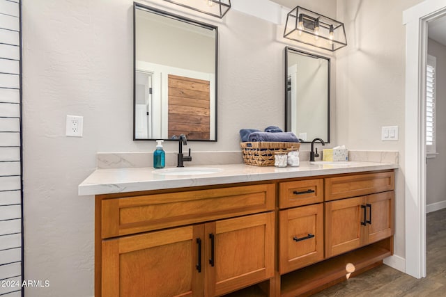 bathroom featuring vanity and hardwood / wood-style floors