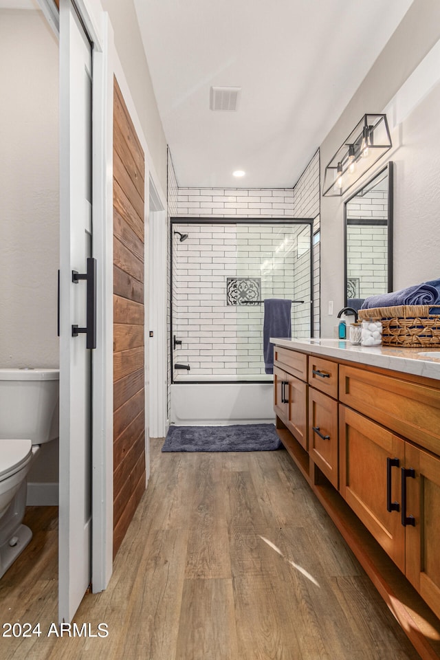 bathroom featuring vanity, toilet, and wood-type flooring