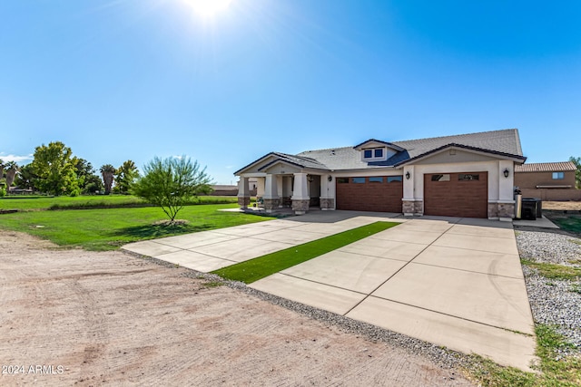 view of front facade featuring a front lawn and a garage