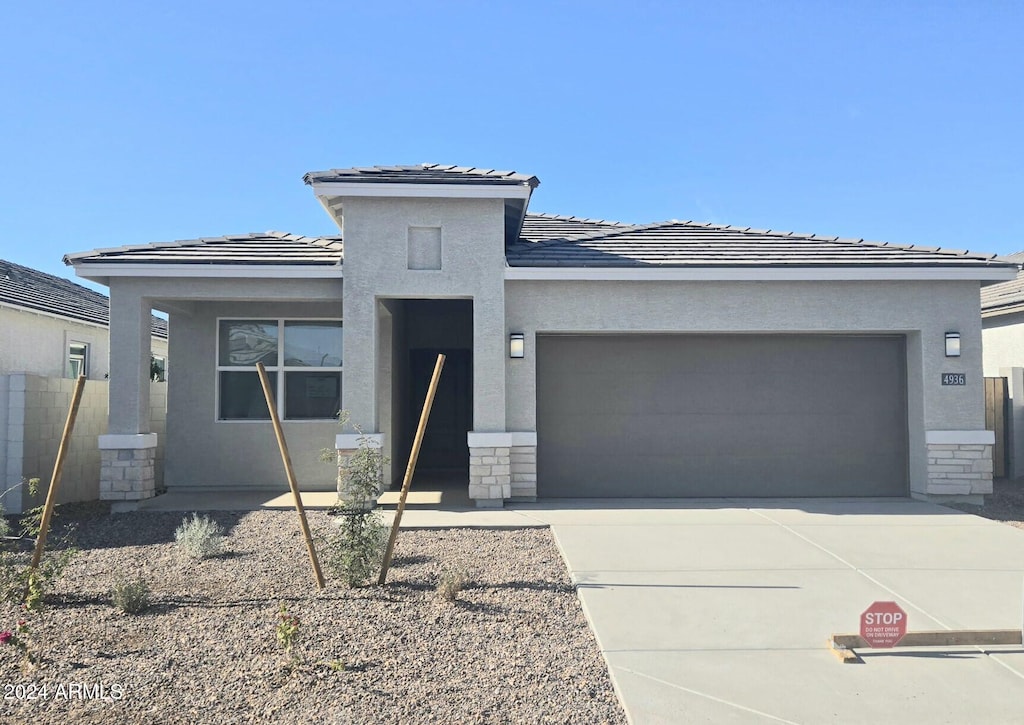 prairie-style house featuring a garage