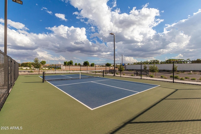 view of tennis court featuring basketball court