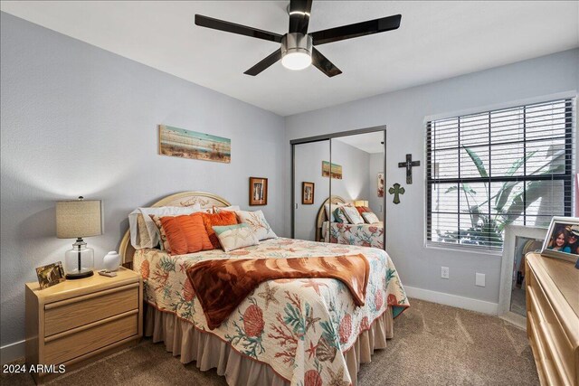 bedroom with carpet flooring, ceiling fan, and a closet