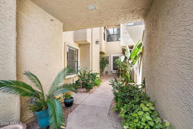 property entrance featuring stucco siding