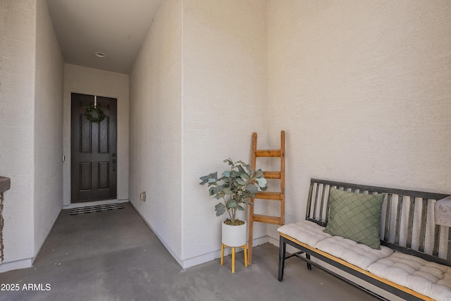 entrance to property with stucco siding