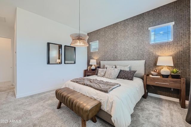 carpeted bedroom featuring baseboards