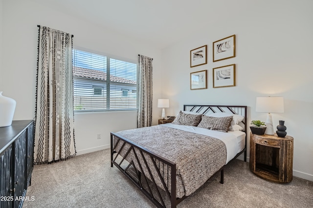 bedroom featuring carpet floors and baseboards