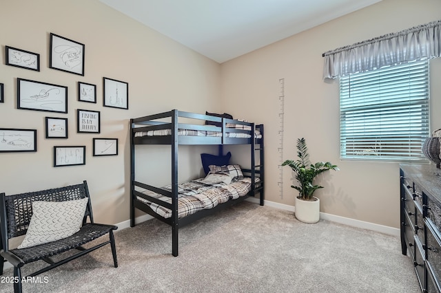 carpeted bedroom with baseboards
