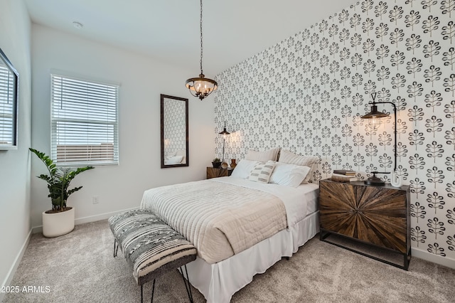 bedroom featuring baseboards, carpet floors, and wallpapered walls