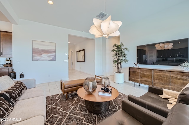 living room featuring light tile patterned flooring and recessed lighting