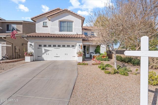 mediterranean / spanish house with a garage