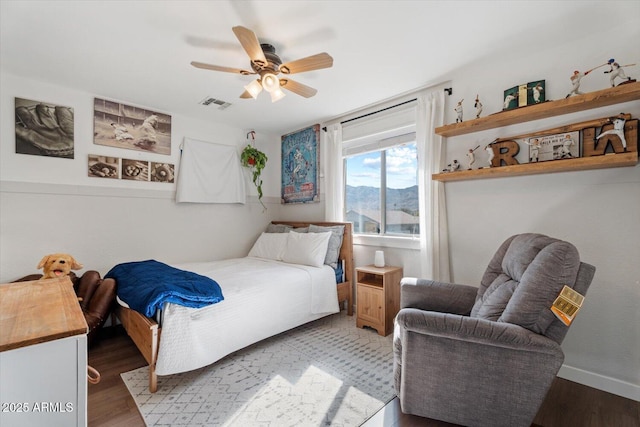 bedroom featuring wood-type flooring and ceiling fan