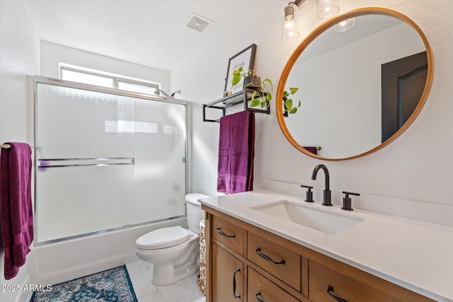 full bathroom featuring vanity, enclosed tub / shower combo, and toilet