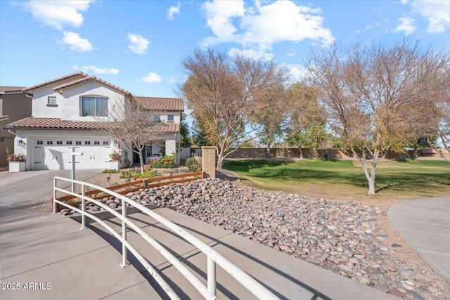 view of front of home with a garage and a front yard