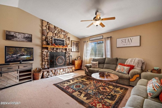 living room featuring ceiling fan, a textured ceiling, vaulted ceiling, a fireplace, and carpet