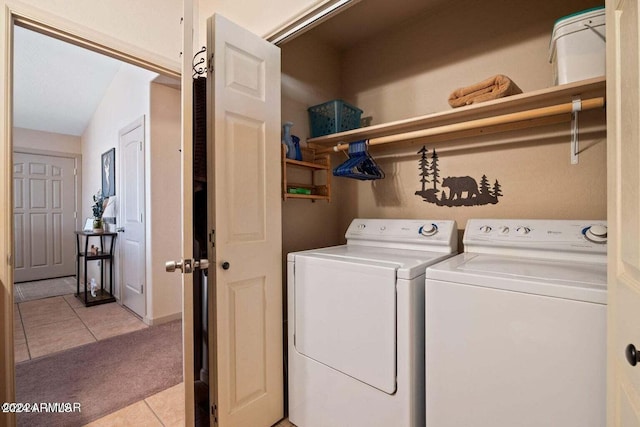 laundry area featuring light tile patterned floors and independent washer and dryer