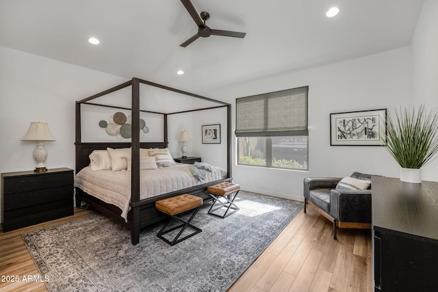 bedroom featuring hardwood / wood-style flooring, vaulted ceiling, and ceiling fan