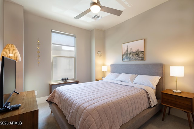 bedroom with a ceiling fan, visible vents, and dark carpet