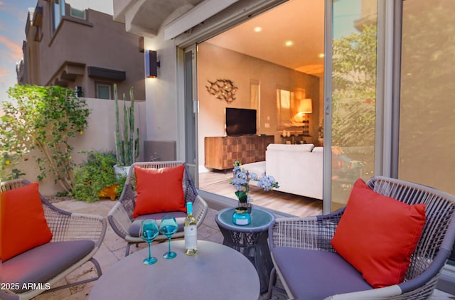 view of patio featuring outdoor lounge area, fence, and outdoor dining space