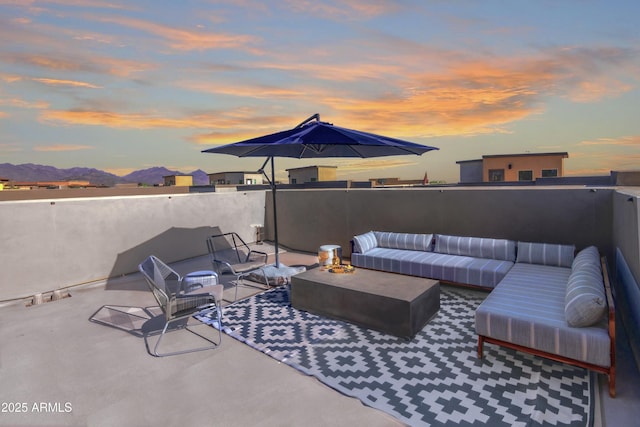 view of patio featuring outdoor lounge area and a mountain view