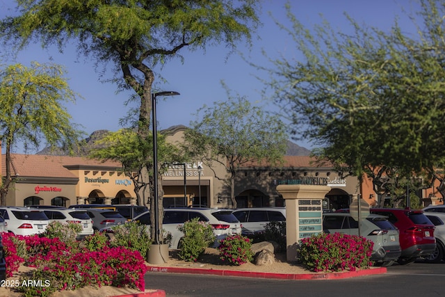 view of property with uncovered parking