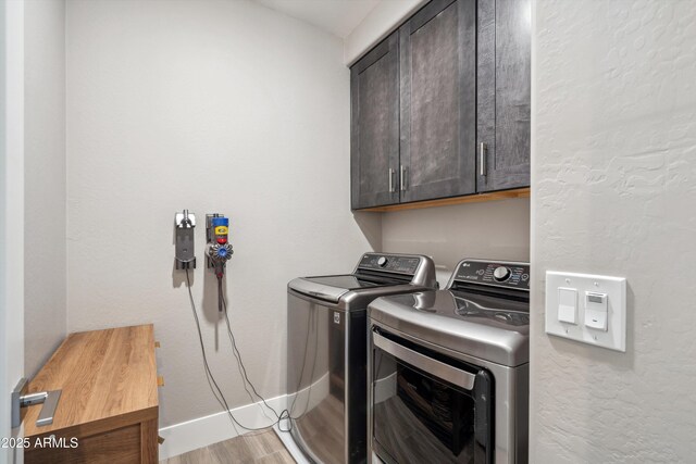 7464 E Paraiso Dr, Scottsdale, AZ 85255 - clothes washing area with separate washer and dryer, cabinet space, baseboards, and light wood-type flooring