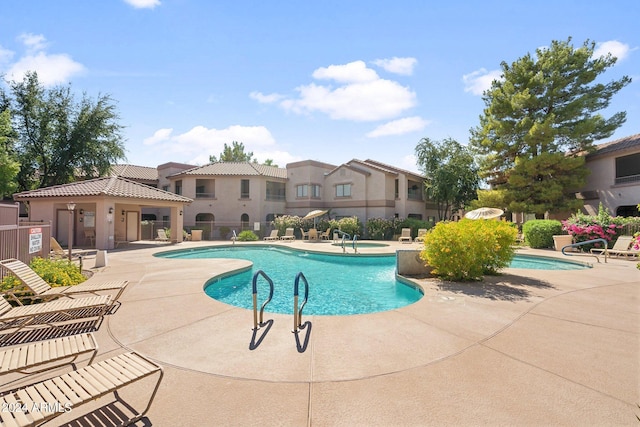 view of swimming pool featuring a patio area