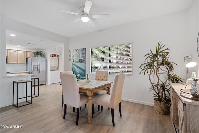 dining area featuring ceiling fan and light wood-type flooring