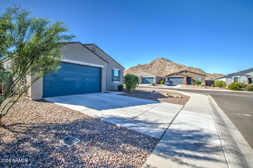 view of front of property with a mountain view