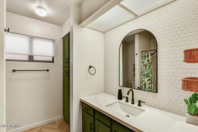 19025 N 96th Ave, Peoria, AZ 85382 - bathroom featuring vanity, toilet, and baseboards