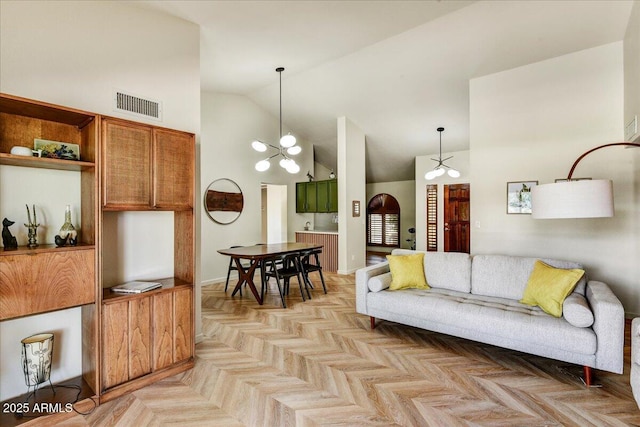 19025 N 96th Ave, Peoria, AZ 85382 - living area featuring high vaulted ceiling, a chandelier, and baseboards