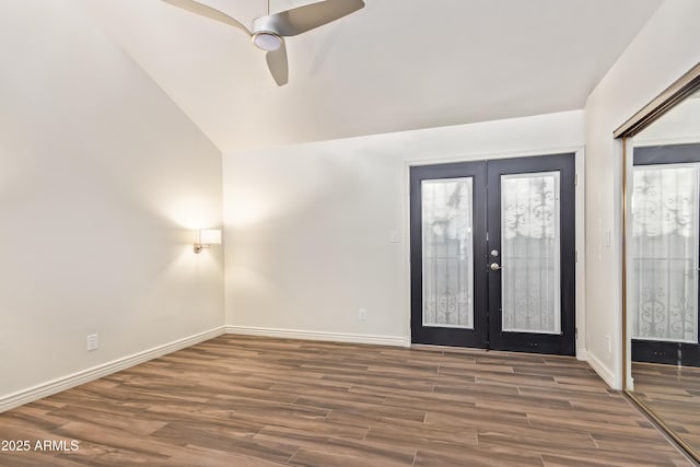 entryway featuring ceiling fan, dark wood-type flooring, lofted ceiling, and french doors