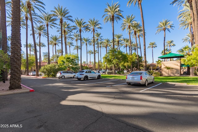 view of parking featuring a playground