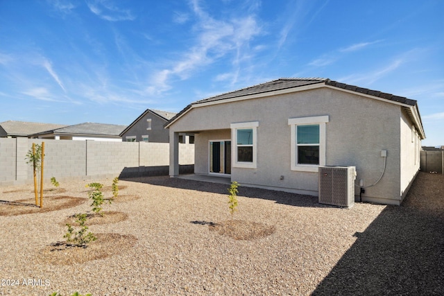 25467 W Graham Trl, Buckeye, AZ 85326 - rear view of house featuring central air condition unit, stucco siding, and a fenced backyard