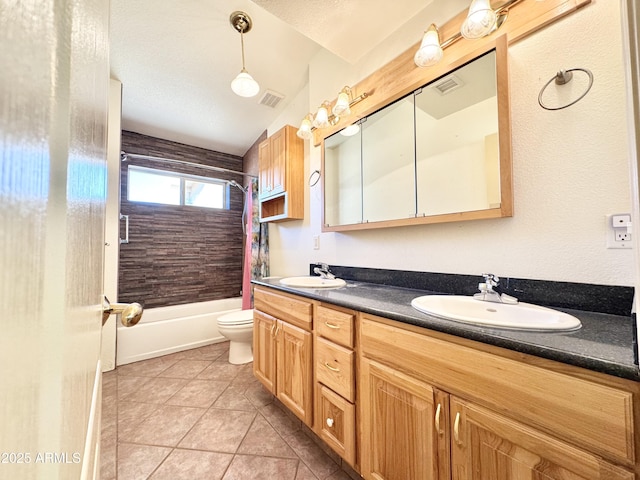 full bathroom featuring double vanity, shower / bath combo, tile patterned floors, and a sink