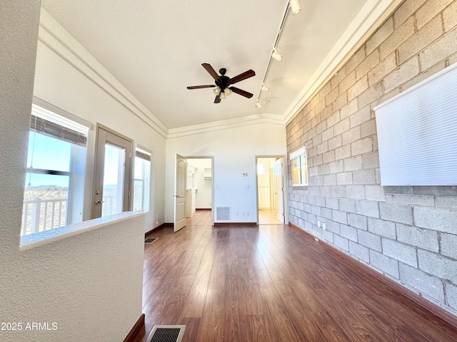 spare room featuring visible vents, wood finished floors, and a ceiling fan