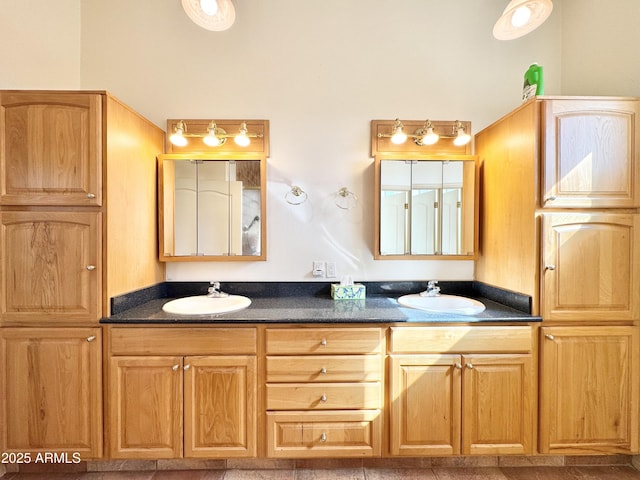 full bathroom featuring a sink and double vanity