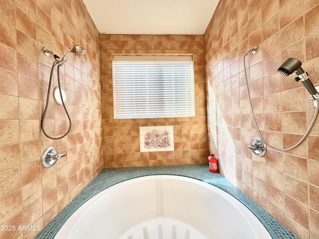 full bathroom with a bathing tub and tiled shower