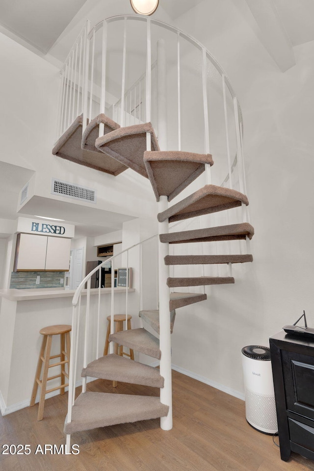 2333 E Southern Ave Unit 2016, Tempe, AZ 85282 - stairs with wood finished floors and a high ceiling
